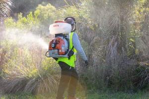 Mosquito barrier spraying with a backback 